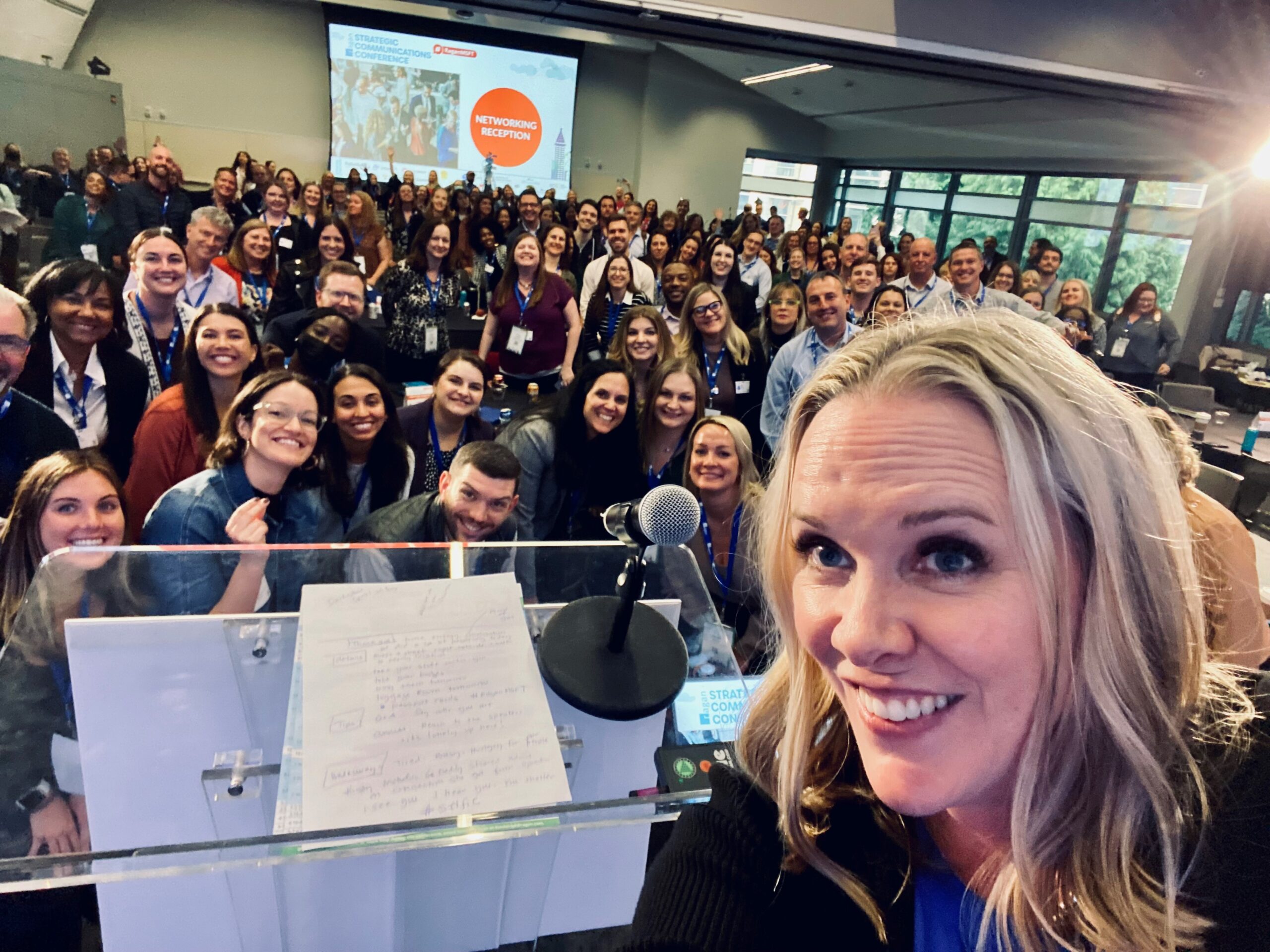 Emcee Kristin Graham and the audience at the 2022 Ragan and PR Daily Strategic Communications Conference