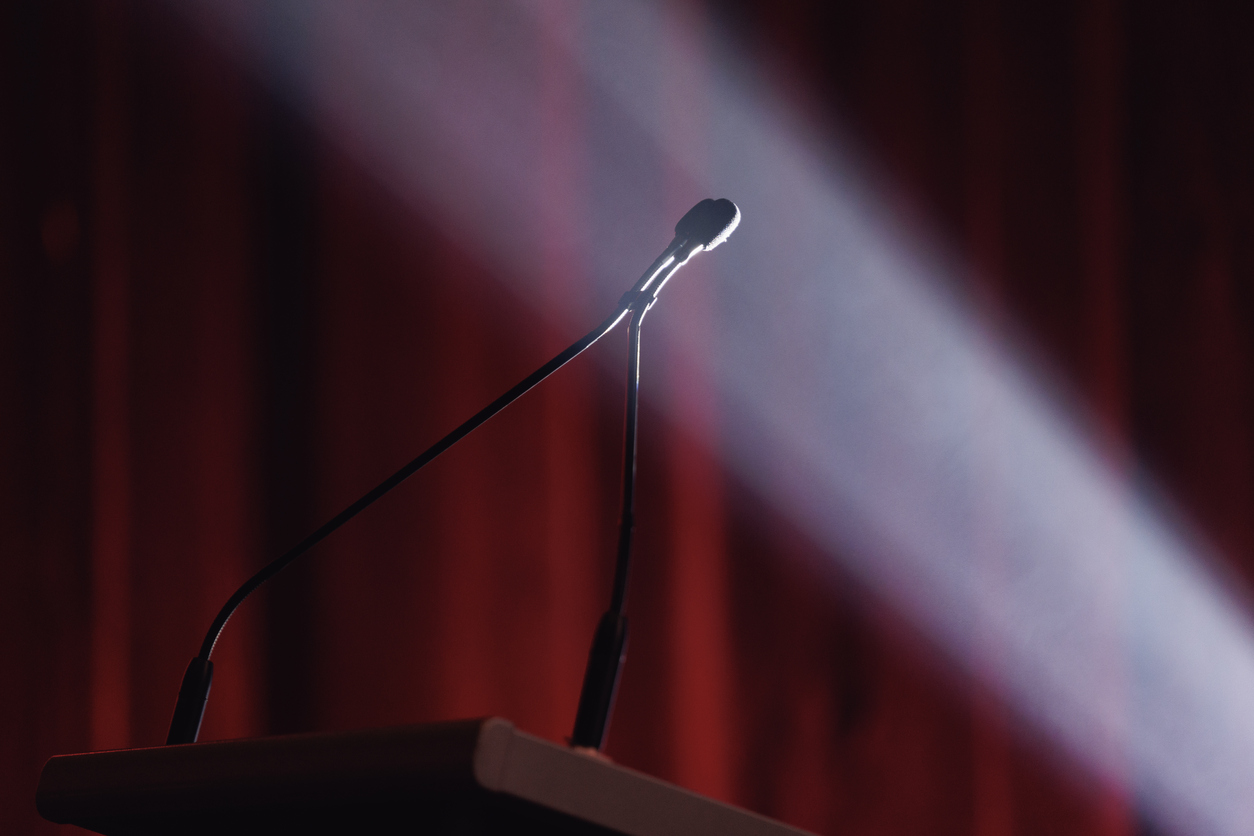Microphone lit by dramatic stage lighting